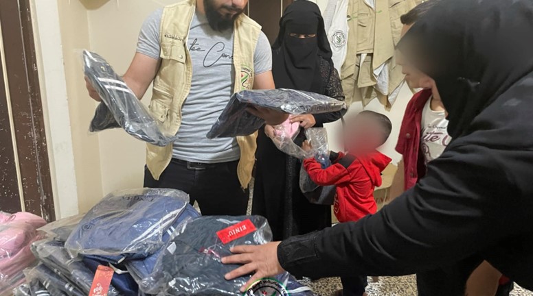 Youth Al-Khair Volunteer Team distributes clothes to orphans